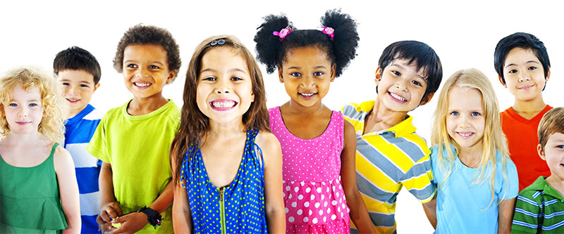 A group of children with diverse skin tones and clothing colors posing for a photo.